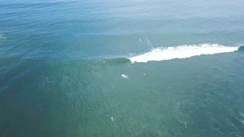 4K Unknown surfer riding small foaming wave in Indonesia Stock Footage 115506872