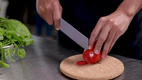 4K, unrecognizable face working concept, close up chef hand chopping tomato.. Stock Footage 246757080
