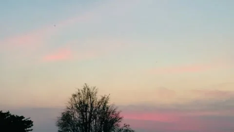 4K Upward Camera Movement Through Pastel Sunset Sky and Pink Clouds Stock Footage 341337202