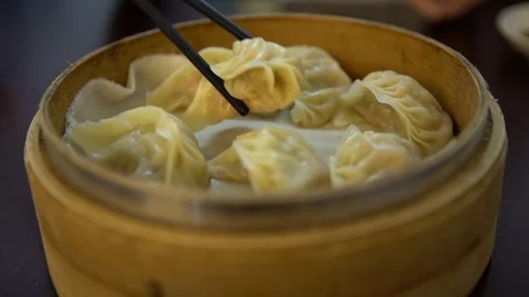 4K Using chopstick for eat dumplings in restaurant. Traditional chinese food-Dan Stock Footage 86092993
