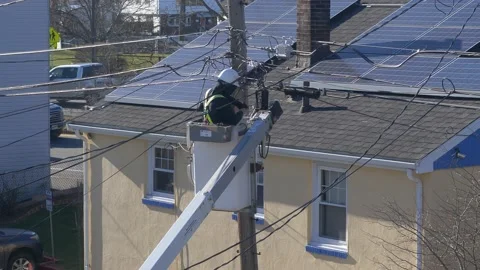 4K Utility Pole electrician worker attaches meter to power lines Video stock 234660388