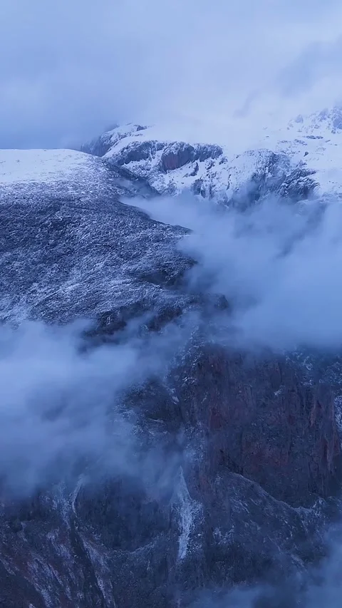 4K Vertical Aerial View of Snowy Aladaglar Mountains at Blue Hour Stock Footage 336449581