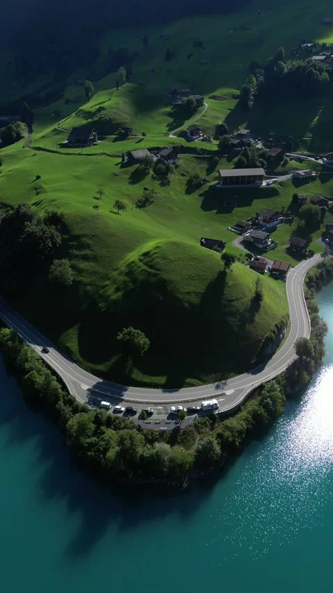 4K - Vertical | Backwards Revealing Drone Shot - Switzerland Lungernsee 스톡 동영상 205558561