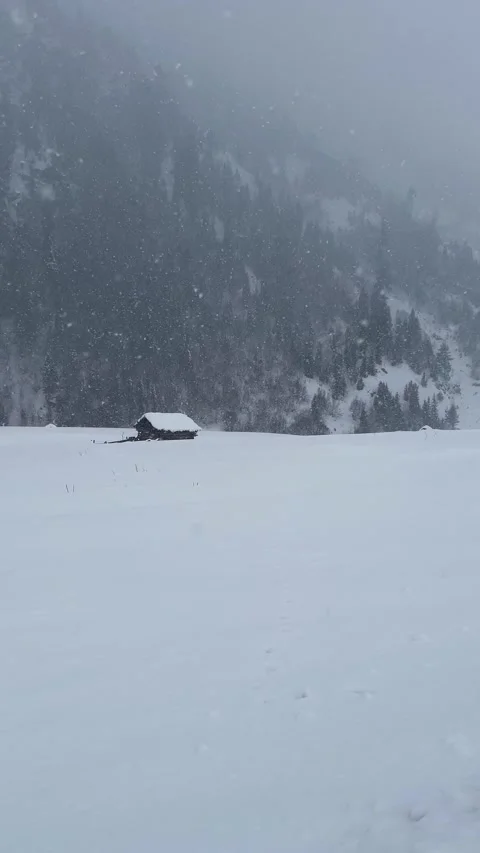 4k vertical clip of isolated cabin in winter landscape Stock Footage 327690273