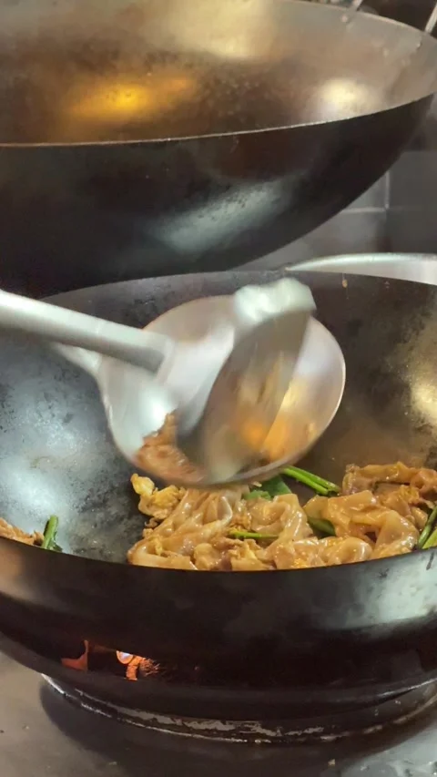 4K vertical close-up of a chef using a spatula to separate and arrange small por Stock Footage 342777416