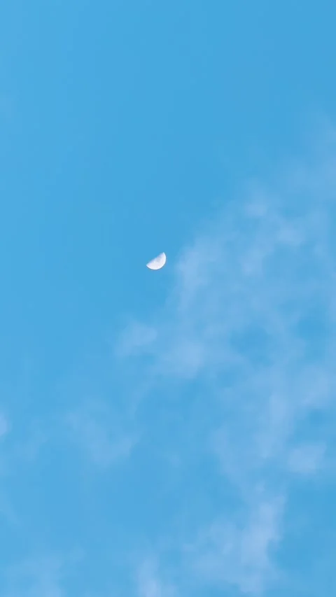 4K Vertical shot of clouds against the blue sky during the evening  Stock Footage 323315060
