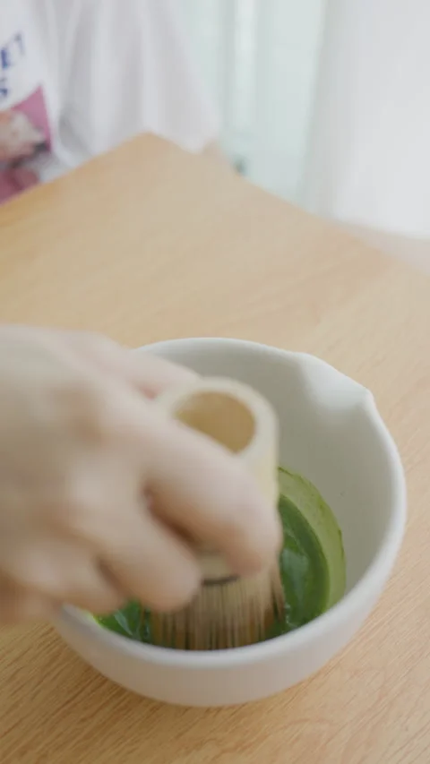4K Vertical shot relaxing weekend lifestyle, making homemade matcha Stock Footage 341170047