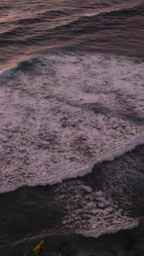 4K vertical slow motion of abstract sea foam patterns at sunset 스톡 동영상 337085532