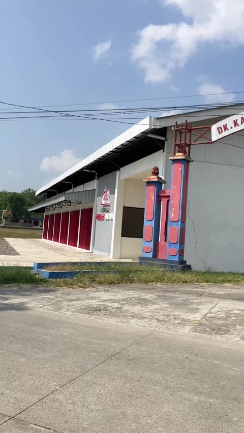 4K Vertical Slow Motion: Moving Side POV Passing Village Cooperative Building Stock Footage 337419301