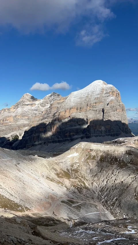 4K Vertical Time‑Lapse of Dolomites Mountain Cliff with Fast‑Moving Clouds Stock Footage 331079322
