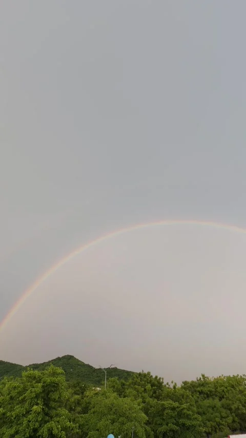 4K vertical video of a beautiful rainbow Stock Footage 345611472