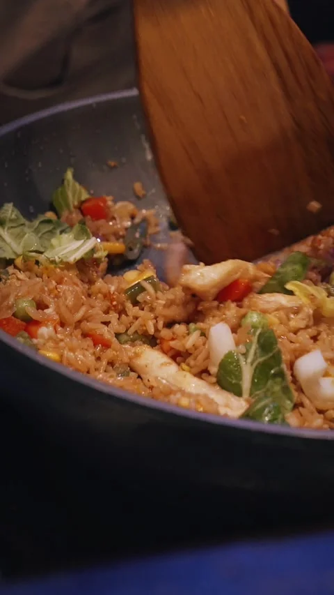 4K vertical video chef cooking rice and noodles wok Stock Footage 316568371