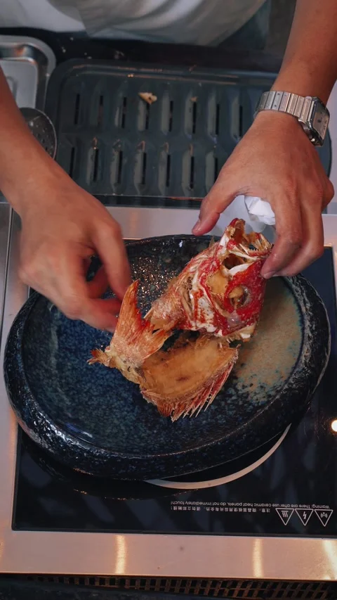 4K vertical video chef plating asian deep fried snapper – overhead shot Stock Footage 315395464