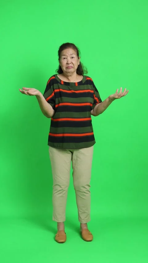 4K vertical video of a senior Chinese woman looking confused and questioning, sh Stock Footage 342777553