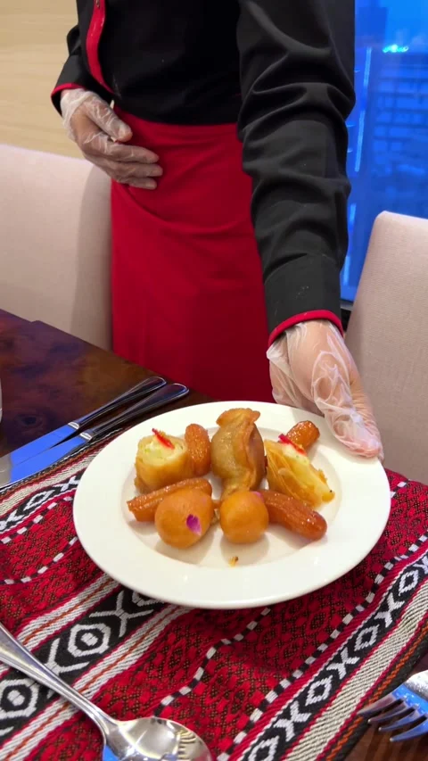 4K Vertical Video: Traditional Fried Sweets Served on Decorative Table. Stock Footage 303944971