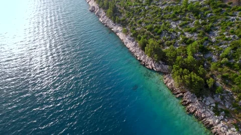 4k vertical view of the sea coast and mountains from drone at sunset Stock Footage 201428587