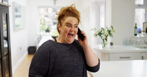 4K Very expressive hyperactive woman talking excitedly on cell phone Stock Footage 88604920