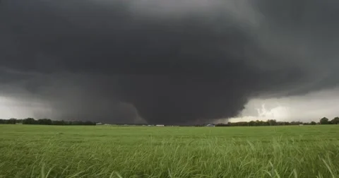 4K Very large tornado beyond farmland. Stock Footage 40399403