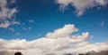 4K video 30p Winter clouds puff in a crisp deep blue sky in timelapse 4k or 4k+ Resolution
