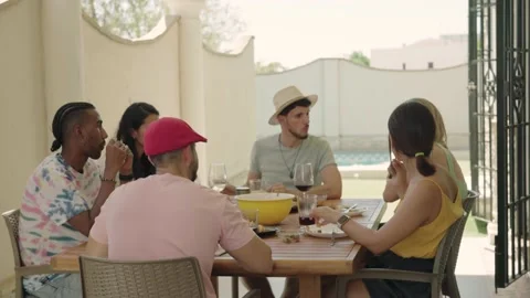 4K video of 6 friends having a barbecue in a house with a swimming pool Stock Footage 219898081