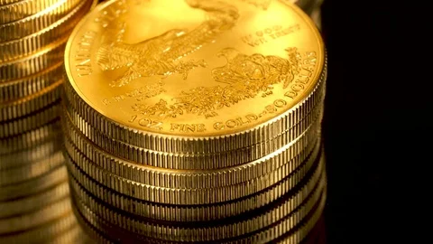 4K video across a stack of gold eagle one ounce coins Stock Footage 81146303