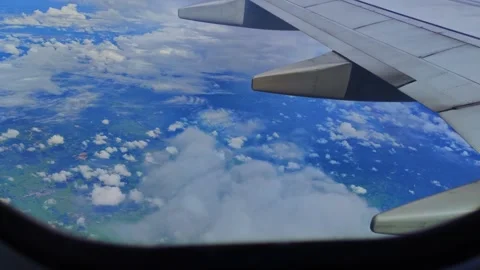 4K video aerial view of the cloudscape through an airplane window Stock Footage 255104564
