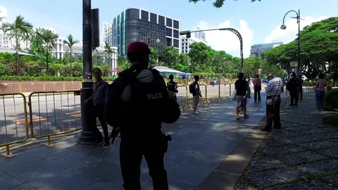 4k video of Armed security awaiting Trump's motorcade Singapore Trump-Kim summit Stock Footage 91113768