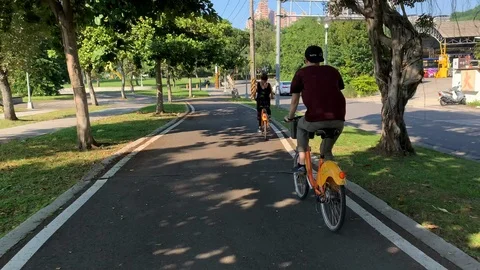 4K Video. Back of couple with the bikes, Taipei, Taiwan. River. Stock Footage 102204096
