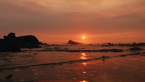 4K video of a beautiful sunset on a beach, with a romantic atmosphere Stock Footage 276844009