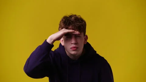 4k video of blank emotion of one man on yellow background. Stock Footage 235243657