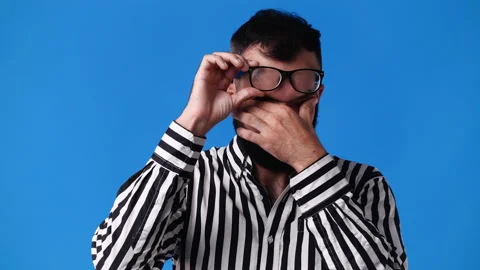 4k video of blank emotion of one man on blue background. Stock Footage 235348014