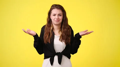 4k video of blank emotion of one girl on yellow background. Stock Footage 236165028