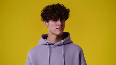 4k video of blank emotion of one man on yellow background. Stock Footage 237614695