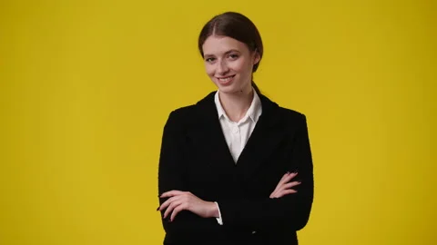 4k video of blank emotion of one girl on yellow background. Stock Footage 238985892