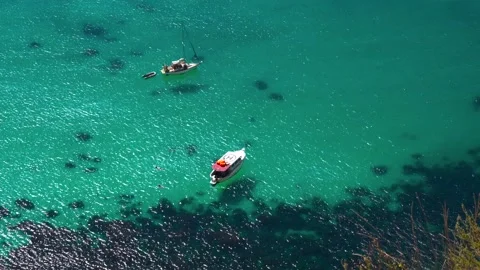 4k video. A boat floats on the azure sea, top view Stock Footage 161806053