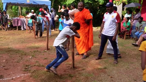 A 4K video capturing the traditional Pani Bambare (Honey Bee) game during Sri Stock Footage 320890732