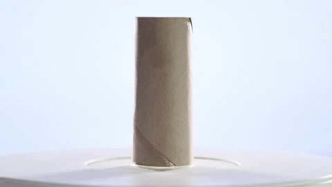 4k video of a carton roll of worn out toilet paper spinning on a turntable. S Stock Footage 144842766