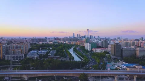 4K video, CBD cityscape view with car traffic flow at riverbank, Beijing, China 動画素材 245006160