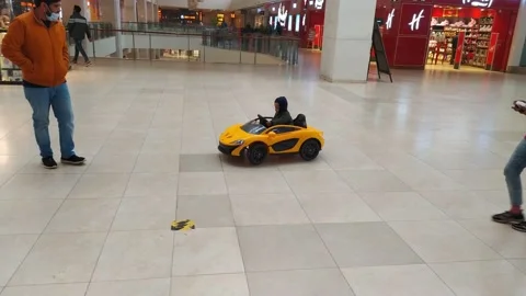 4K Video of a child ride a small car. Stock Footage 147980751