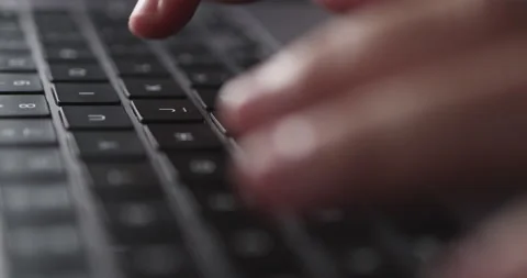 4K Video close up hand typing on keyboard notebook. Concept for coding and te Stock Footage 169322994