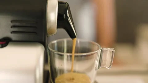 4k video of coffee coming out of an espresso machine Stock Footage 220234459
