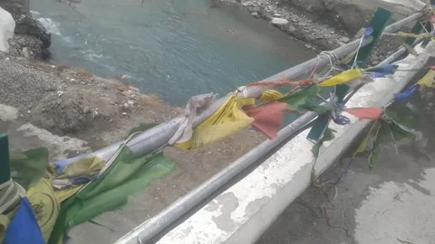 4K Video of colourful flags blowing in hills. Stock Footage 331660746