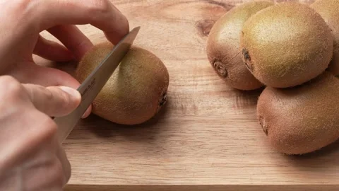 4K video of cutting kiwi. Stock Footage 289610387