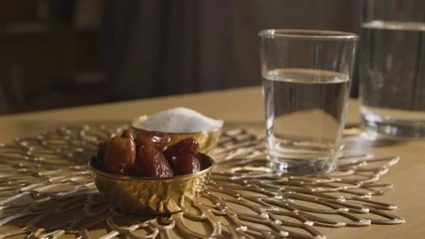 4K Video Dates and Glass of Water for Ramadan Iftar Fast Breaking Stock Footage 330422358