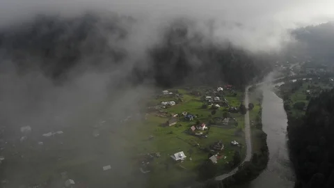 4k Video of the dawn over the village covered with morning fog. Stock Footage