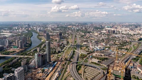 4k video depicting a time lapse of clouds moving over a large metropolis, a Stock Footage 273198474