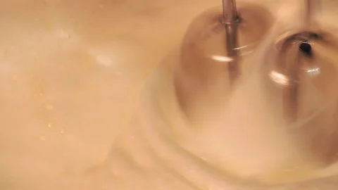 4k video detail beating egg white with an electric mixer. Stock Footage 262655438