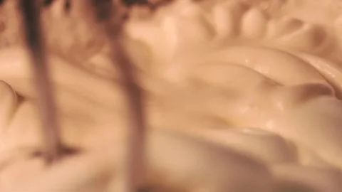 4k video detail beating egg white with an electric mixer. Stock Footage 262655473