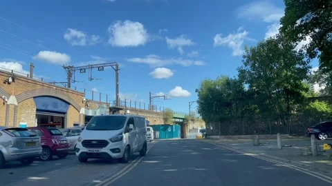 4K video driving next to various iconic yet anonymous UK Railway arches Stock Footage 215616511