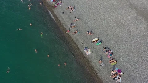 4k video drone flight over tourists on the Black Sea coast in summer Video stock 150967483